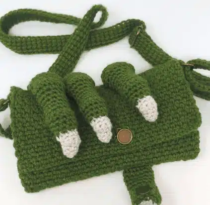 16 Best Free Crochet Dragon Patterns for Beginners & Experts 6 Dragon Claw Clutch Purse