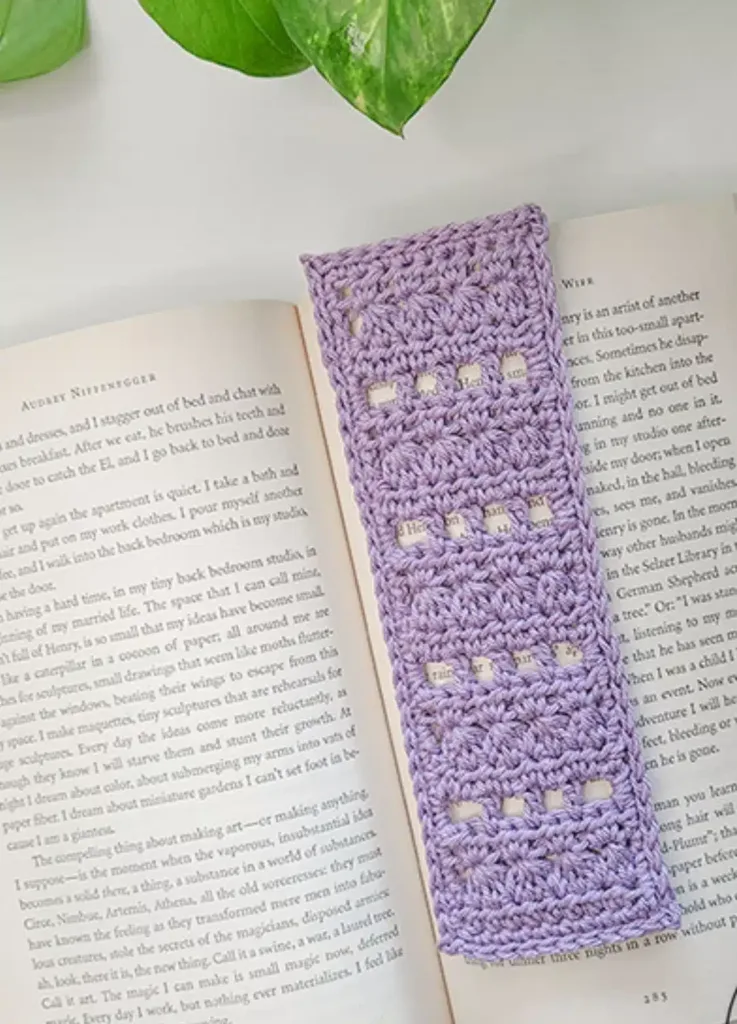 Lacy Ehdc stitches shape this 7-inch crochet bookmark pattern
