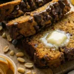 Sliced peanut butter banana bread—moist, nutty, chocolate pockets
