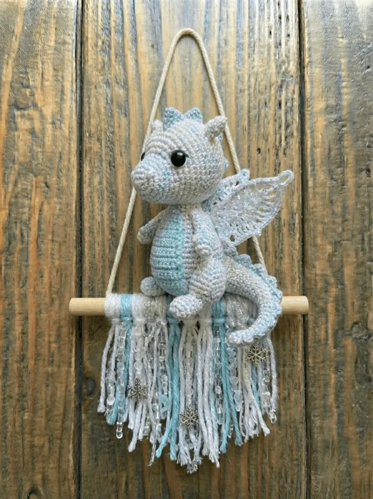 Handmade crochet wall hanging ice dragon using premium yarn, winter fiber art decor