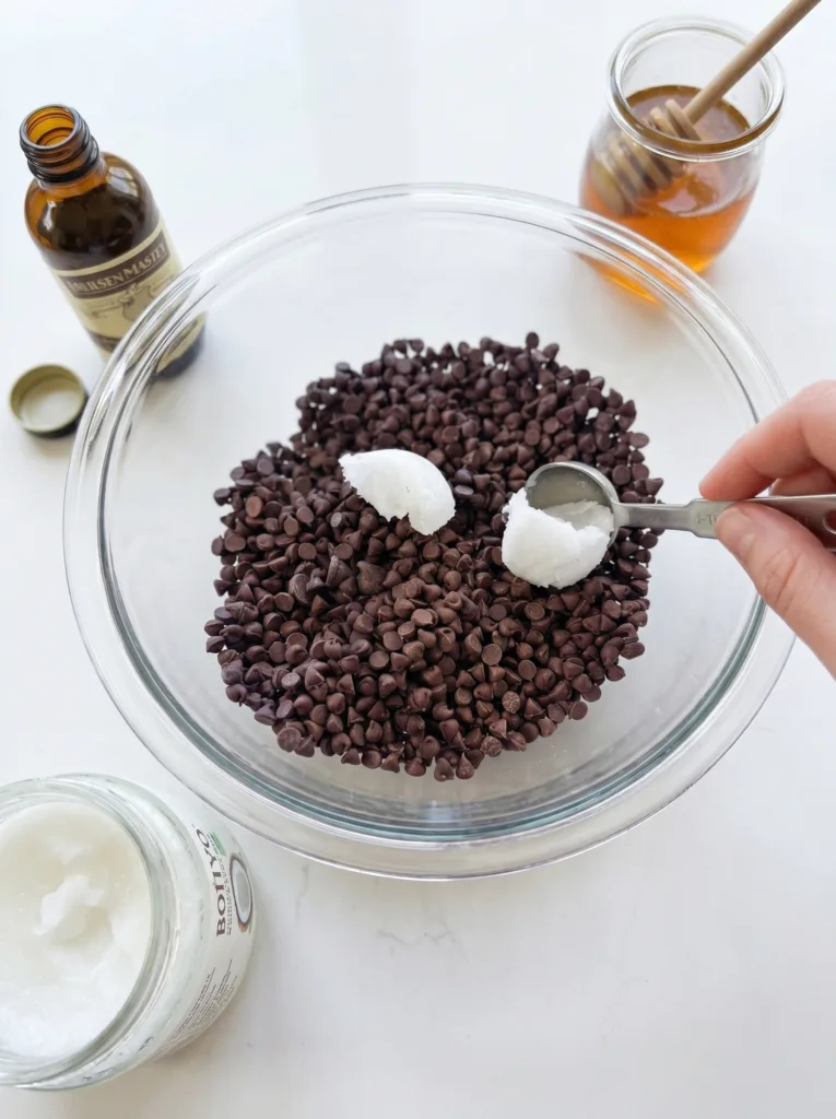 Chocolate chips and coconut oil ready to melt for yogurt cluster coating