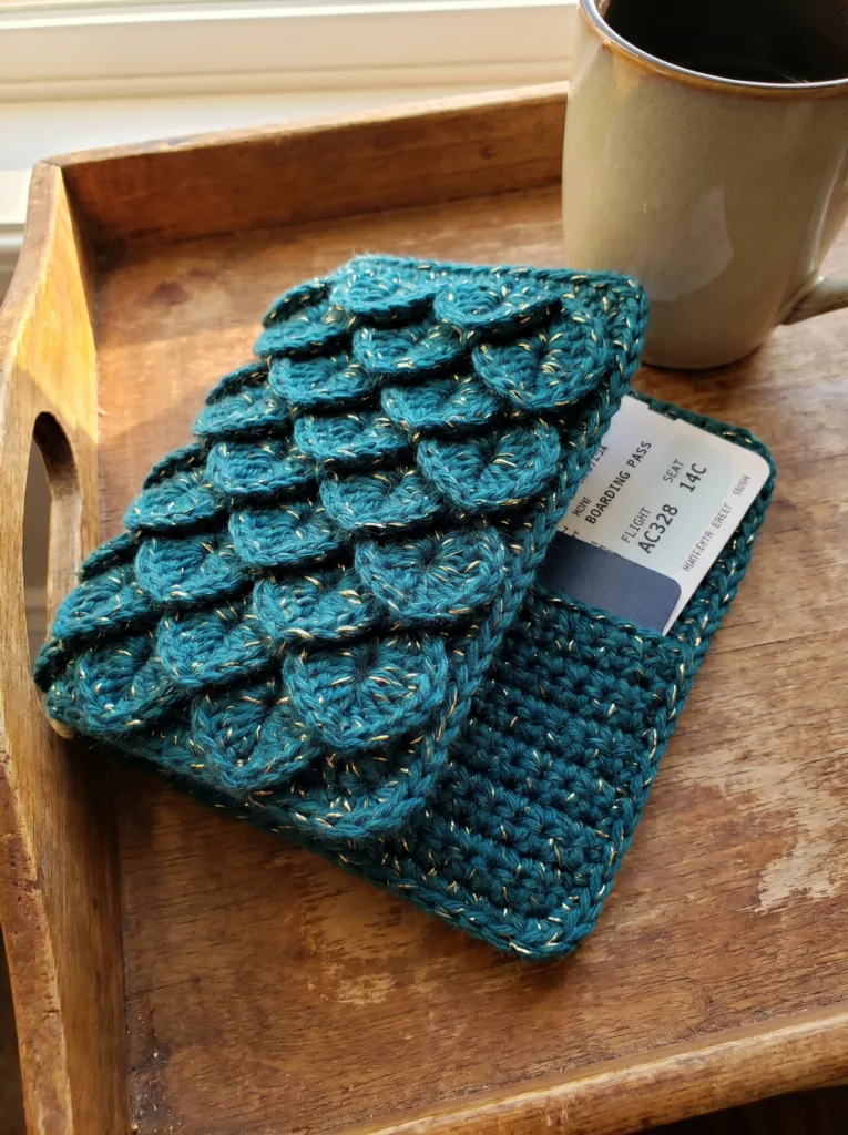 Crochet dragon scale passport cover in deep teal with gold metallic thread