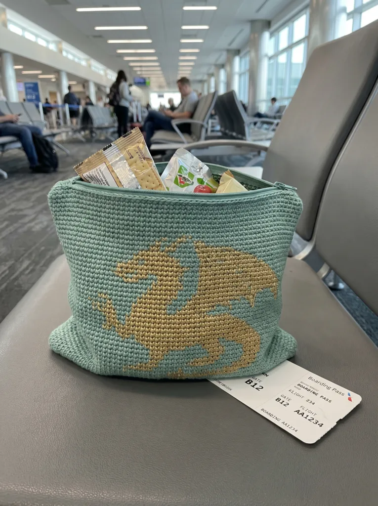 crochet snack bag with a gold tapestry crochet dragon