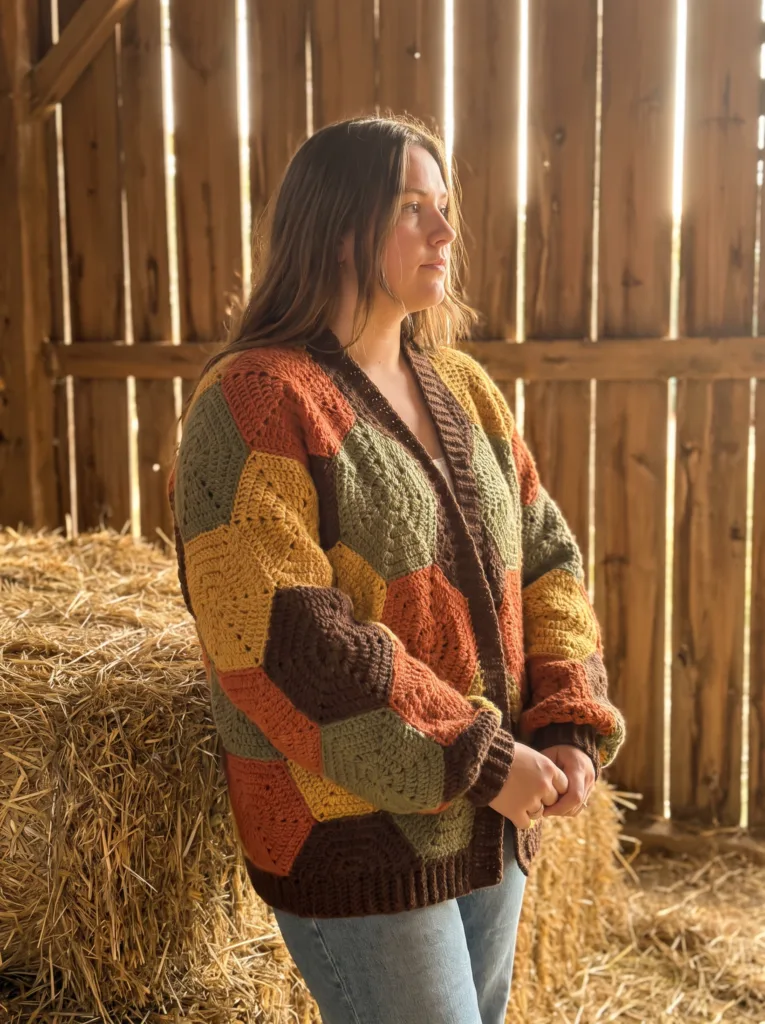 Crochet hexagon patchwork cardigan in burnt orange, olive, mustard, and brown autumn tones