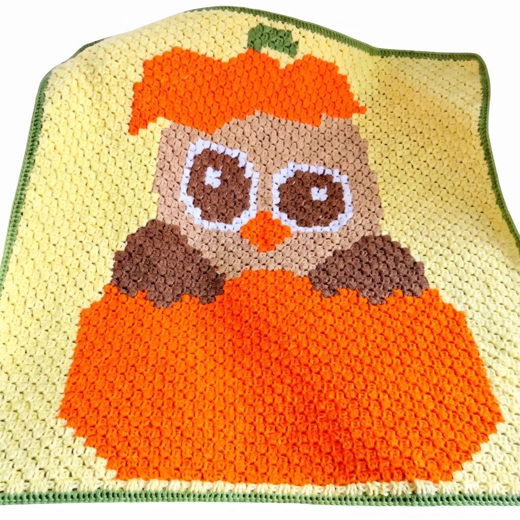 Crochet fall owl blanket, pumpkin colored graph pattern
