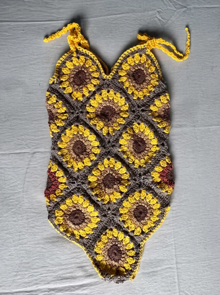 Crochet motif baby romper, sleeveless sunflower pattern